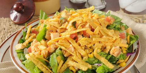 a bowl of taco salad with tortilla strips