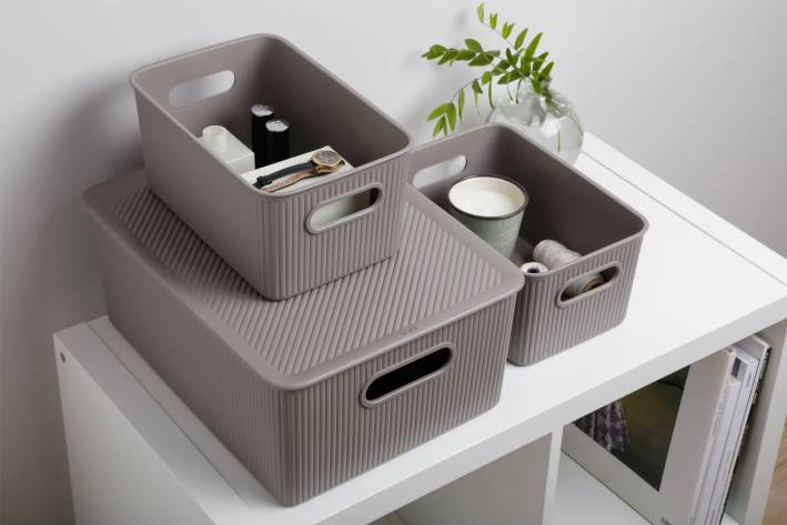 taupe baskets stacked on top of each other