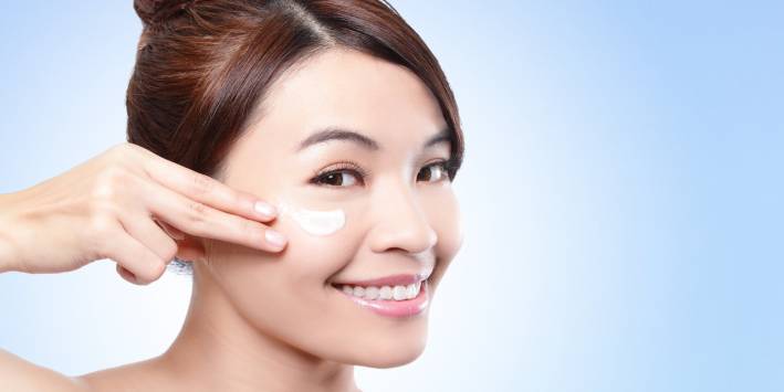 BB Creams Woman putting cream on her face