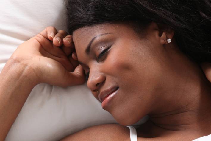 Get a Good Night’s Sleep: The Ayurvedic Way a woman having a peaceful rest
