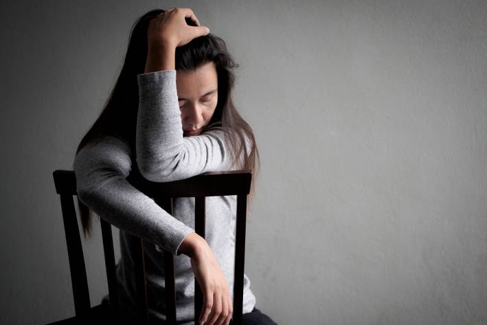 Nutritional Help to Fight Depression in Women A woman slumped in a chair