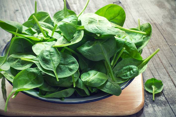 Spinach: The Most Nutritious Vegetable fresh baby spinach piled high in a dish
