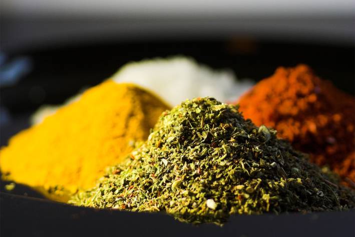 piles of fresh herbs used in ayurveda