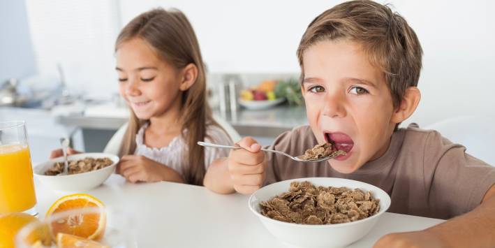 Diet Detective Determines 10 Healthiest Cereals children eating cereal