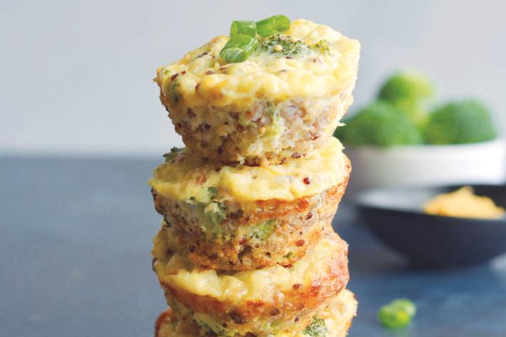 Cheesy Broccoli Quinoa Egg Muffins Cheesy Broccoli Quinoa Eggs Muffins stacked like a tower.