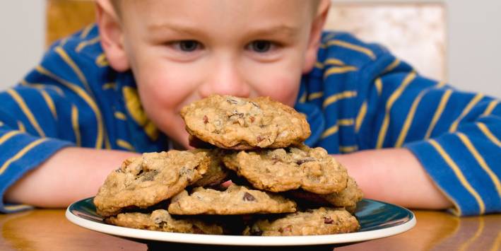 Gluten-Free Trail Cookies Child looking at cookies