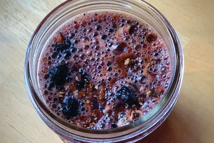 Spiced Maca Cacao Libido Vitality Tea a mason jar full of herbal tea for the libido