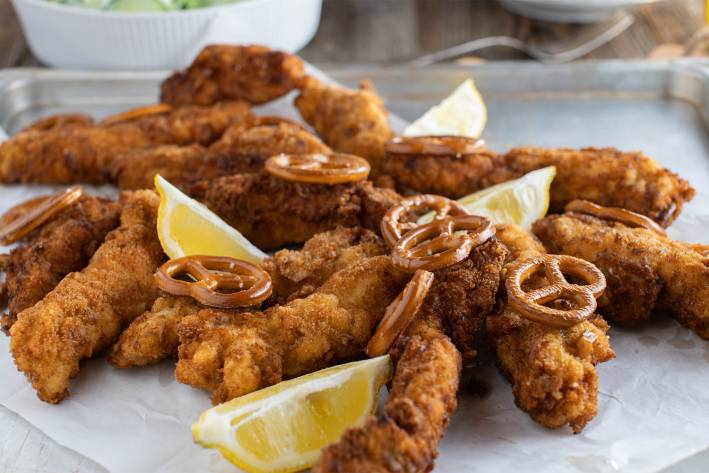 Gluten-Free Honey-Mustard Pretzel Chicken a plate of baked chicken breaded with pretzels
