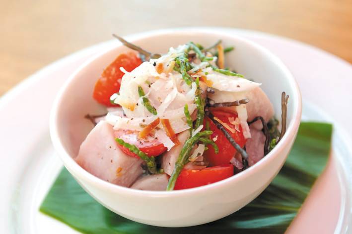 Island Ono Poisson Cru a bowl of seasoned fish