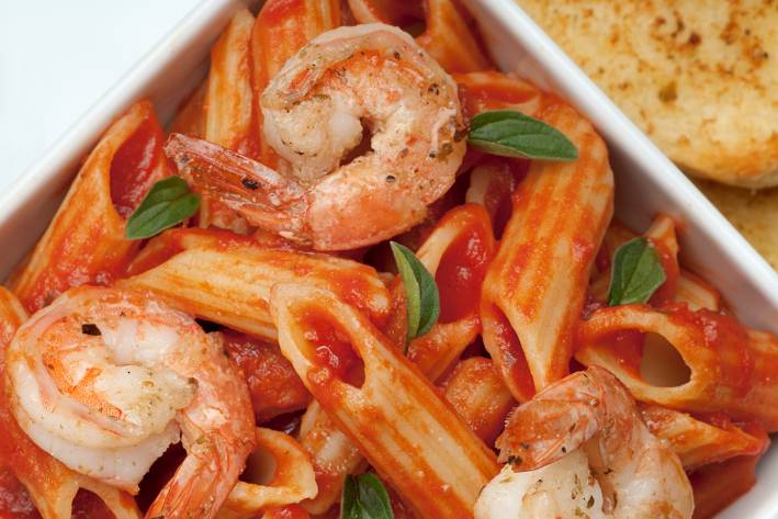 Pasta Combinations a bowl of penne and shrimp in red sauce