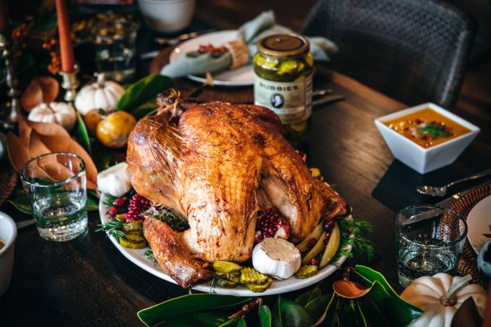 Pickle Juice Brined Turkey a roast turkey and a jar of pickles