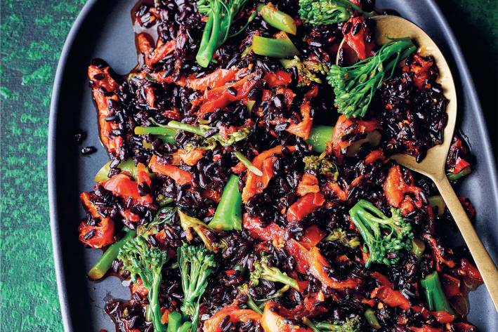 Warm Harissa, Broccolini & Black Rice Salad a plate of spiced black rice with vegetables