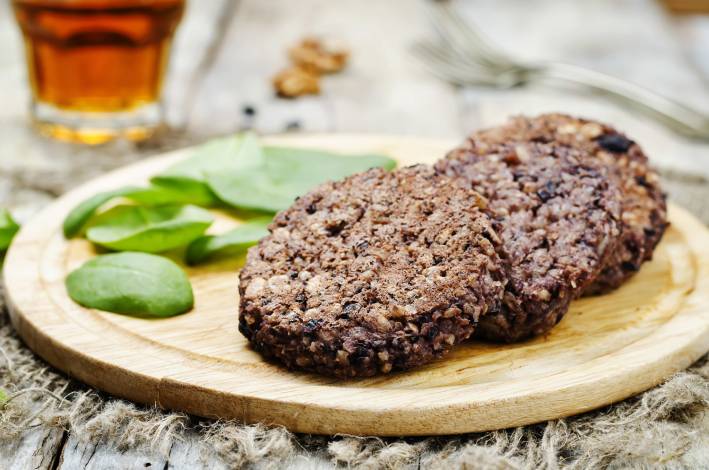 Chipotle Black Bean and Rice Burger Prepared Chipotle Black Bean and Rice Burgers on a cutting board.