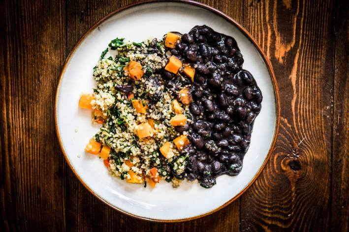 Black Bean and Quinoa Salad with Quick Cumin Dressing A plate of black beans, quinoa, and bell peppers