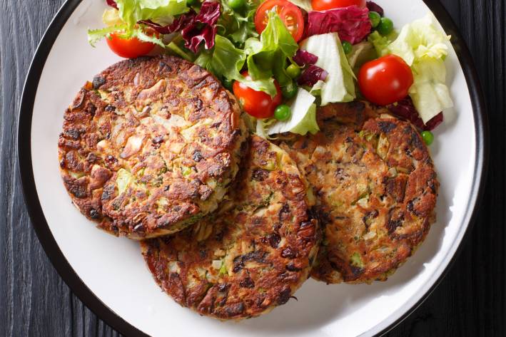 Black-Eyed Pea Cakes a platter of vegetarian patties with a side salad