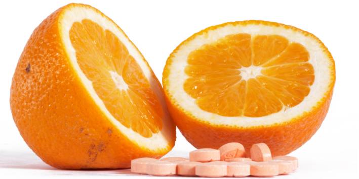 Vitamin C: Absorption and Uses Orange with vitamin C supplements