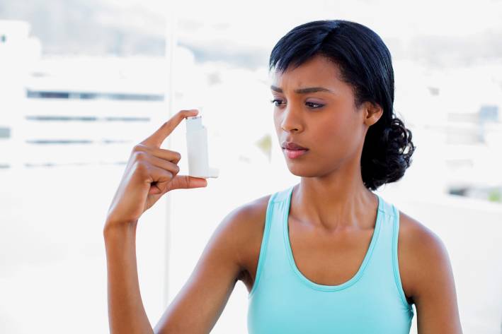 Vitamin D May Curb Asthma Attacks A woman wondering about her asthma inhaler