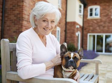 an older woman and a bulldog with sagging jowls