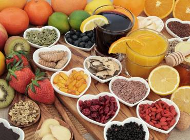 Superfoods for immunity collected in separate heart-shaped bowls.